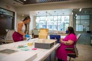 Michelle Smith and Autumn Brown working with the collection